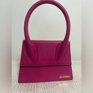 Worn pink Jacquemus bag